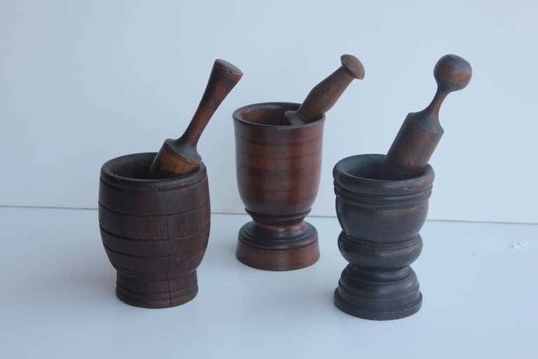 Collection of beautiful antique wood mortars & pestles.