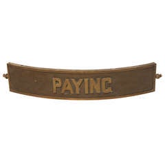 Antique Bronze Sign " Paying "