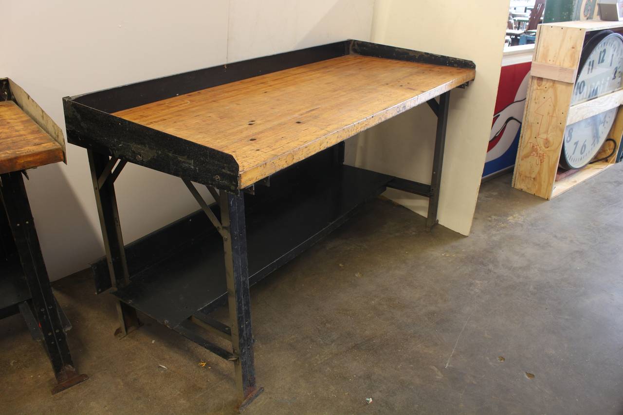 Vintage American Industrial work table with metal base. Back splash can be removed. We have five tables available.