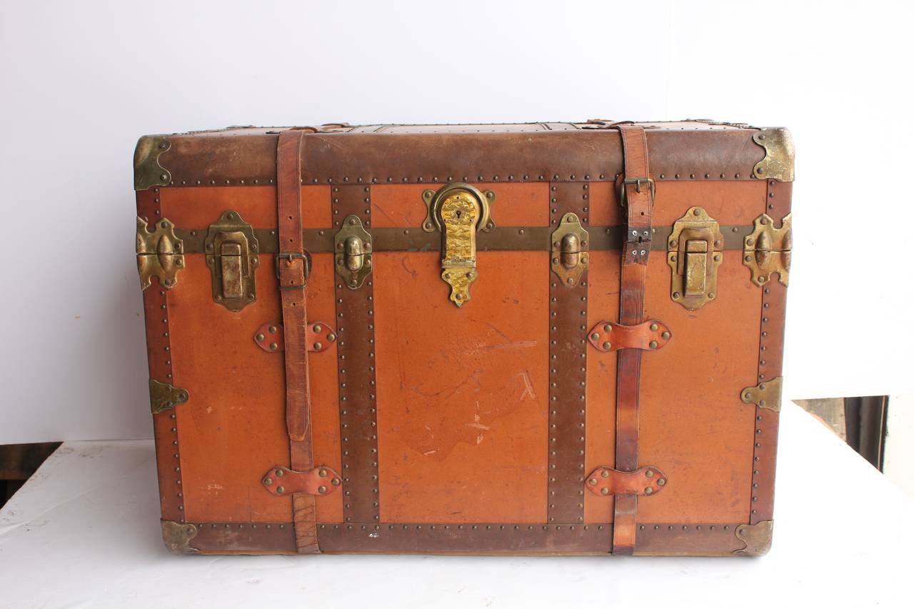 Antique leather trunk. Great as coffee table. Very clean inside.