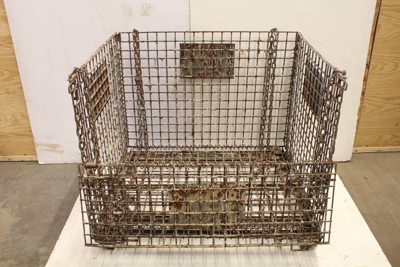 Giant antique American industrial collapsible basket. We have seven available.