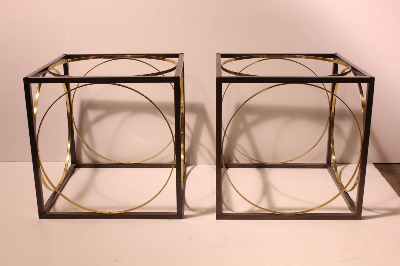 Stylish modern bronze and brass cube tables with smoked glass tops.