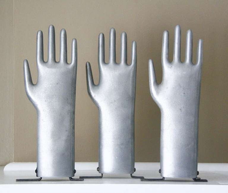 Vintage original American industrial metal freestanding glove mold. Great for displaying jewerly. We have five molds available. Listed price is for each mold.