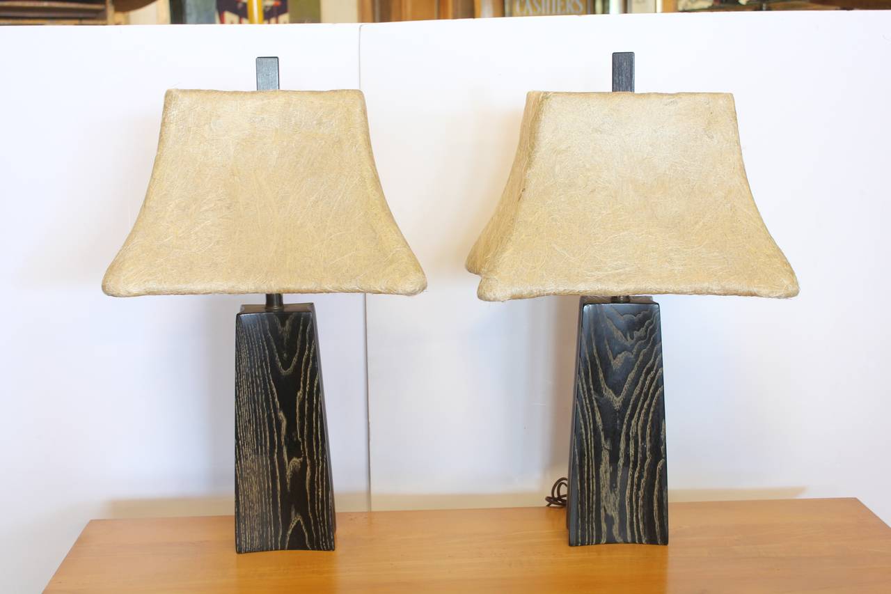 Rare cerused oak table lamps designed by James Mont. Original shades.