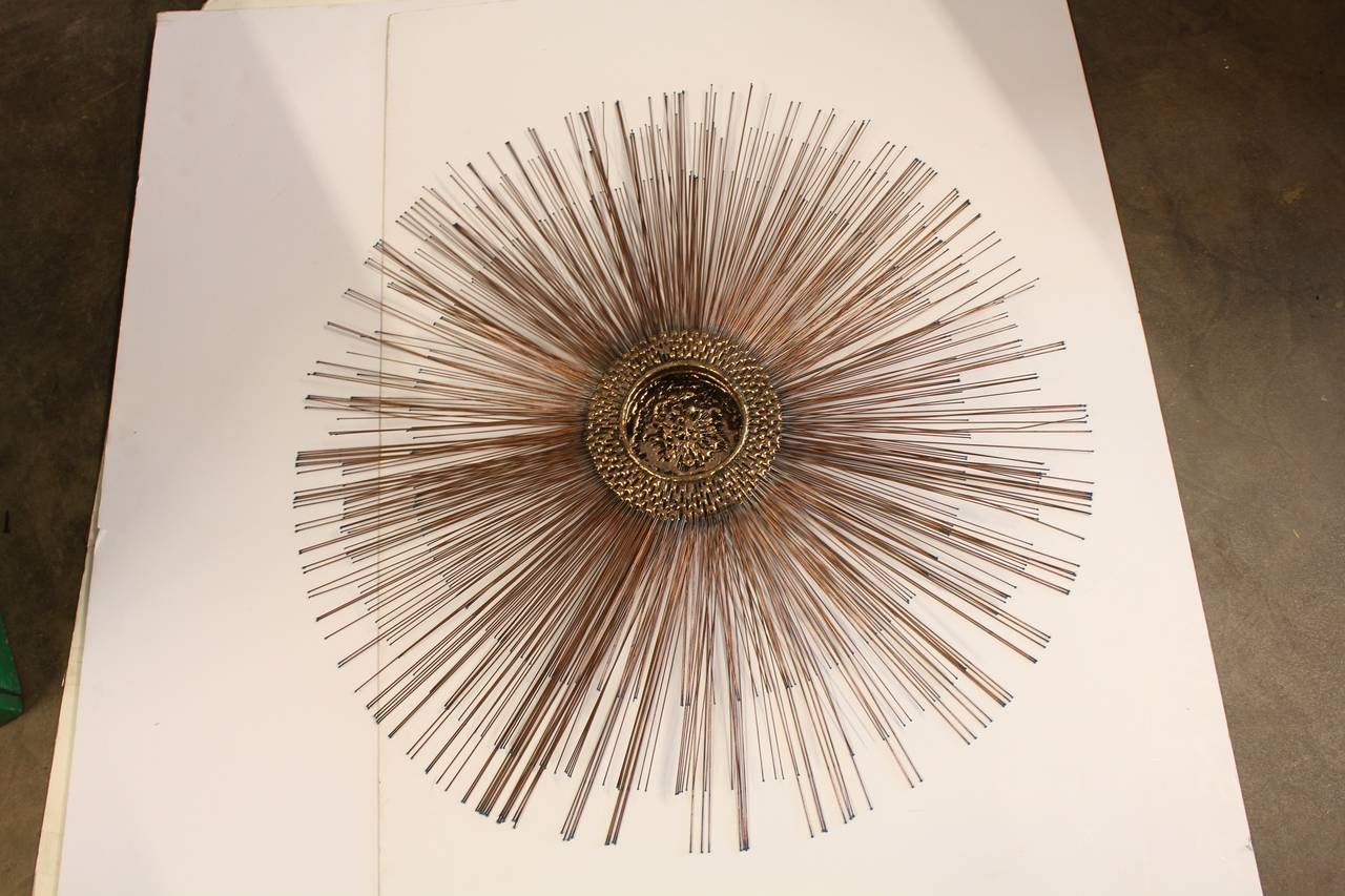 Stylish Mid-Century Brutalist copper sunburst wall sculpture.