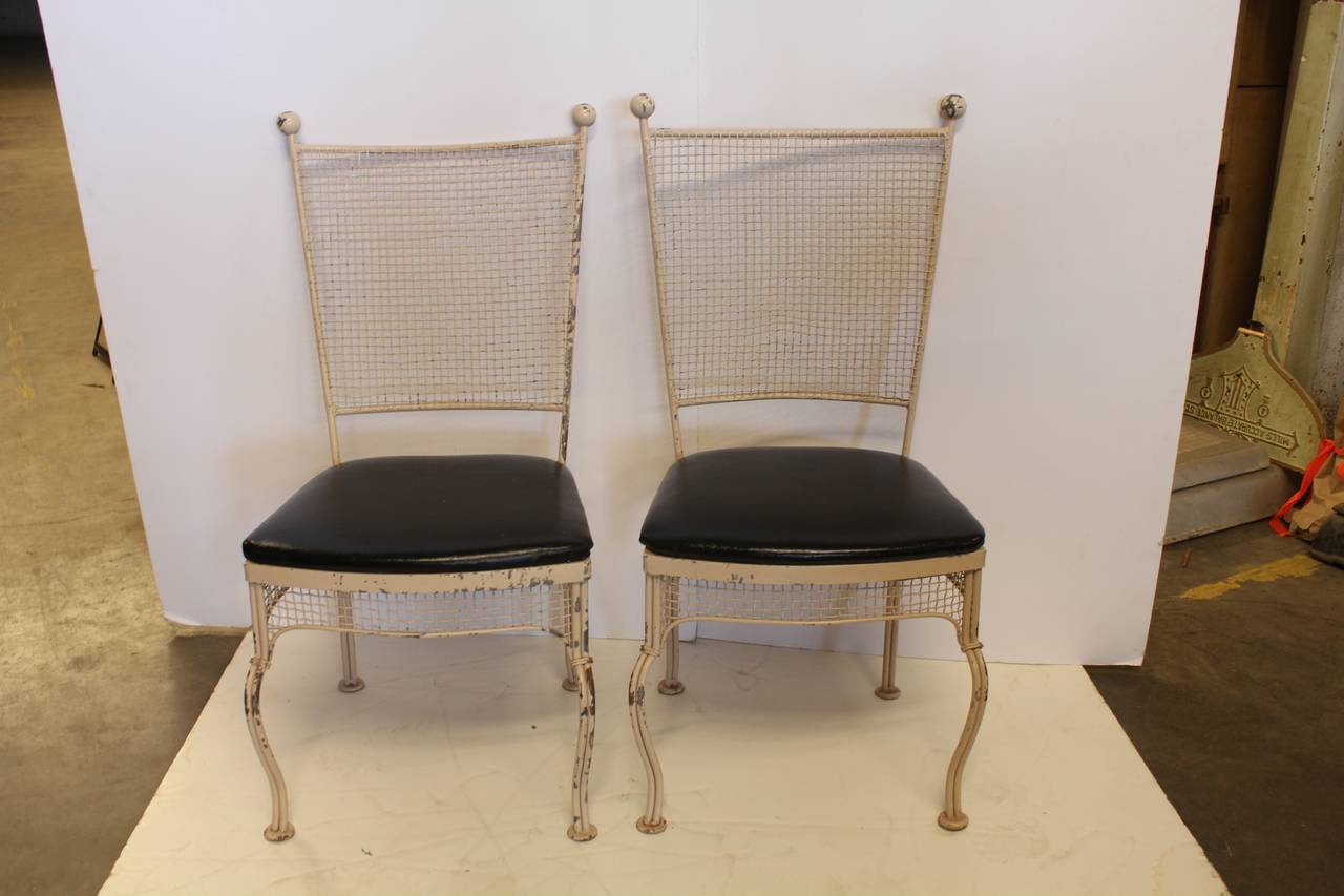 Stylish mid century metal garden chairs by Woodard.