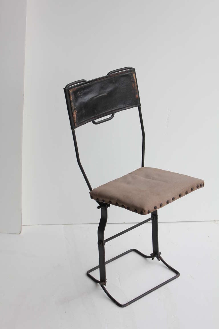 Antique folding chair designed by Calvin A. Buffington for Ford Model T car.
