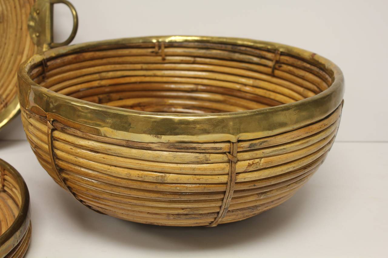 Beautiful collection of three Mid-Century brass and rattan bowls. Tall bowl: 7.5