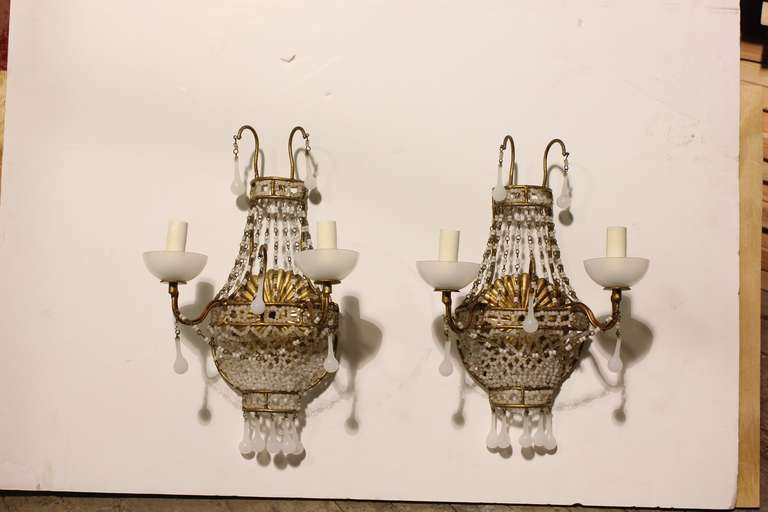 Beautiful set of two 1920's white Opaline wall sconces. Rewired and in working condition.
