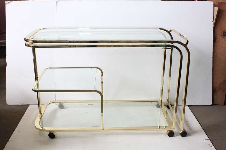 Stylish over sized swivel bar cart with glass shelves. Size: L when is fully open 98