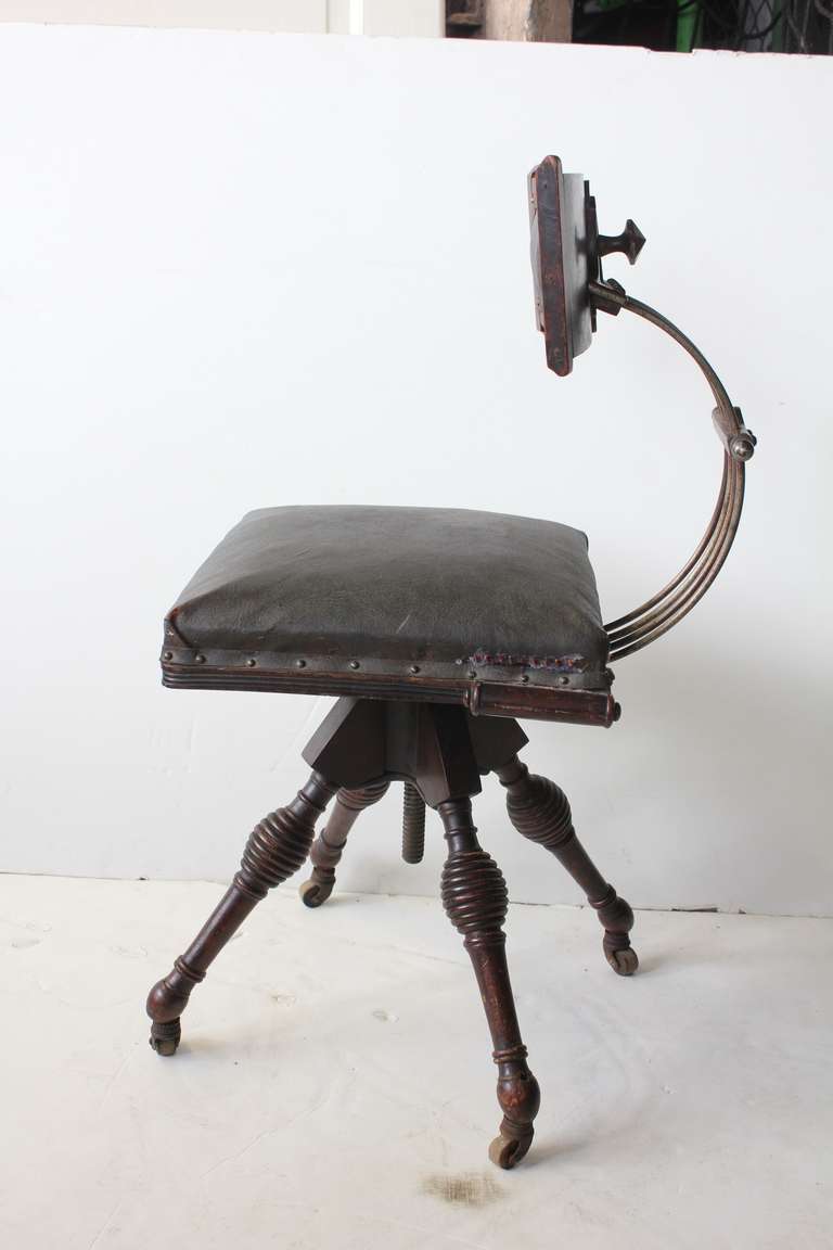Antique desk swivel leather chair.