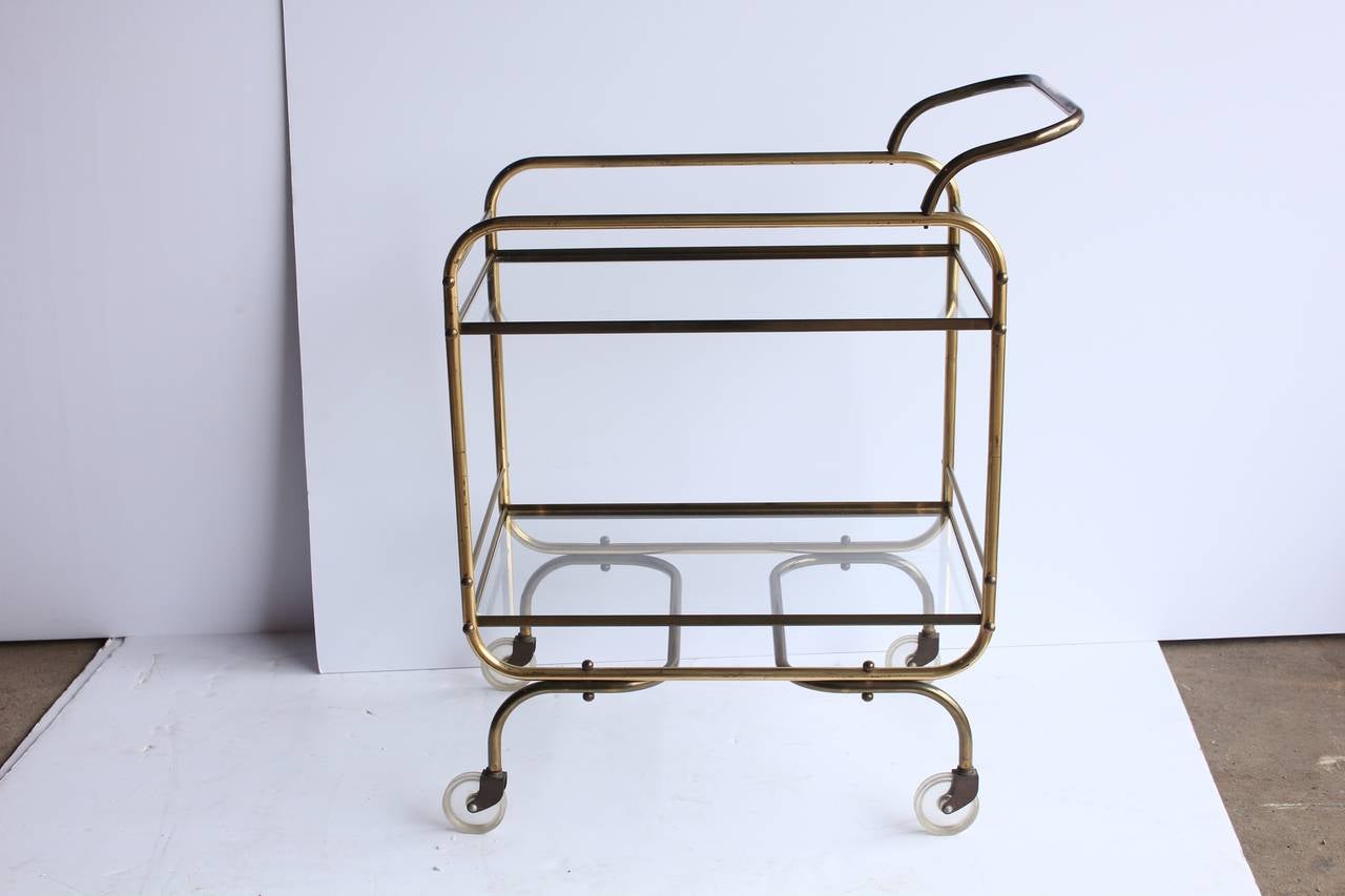Mid century brass and glass bar cart.