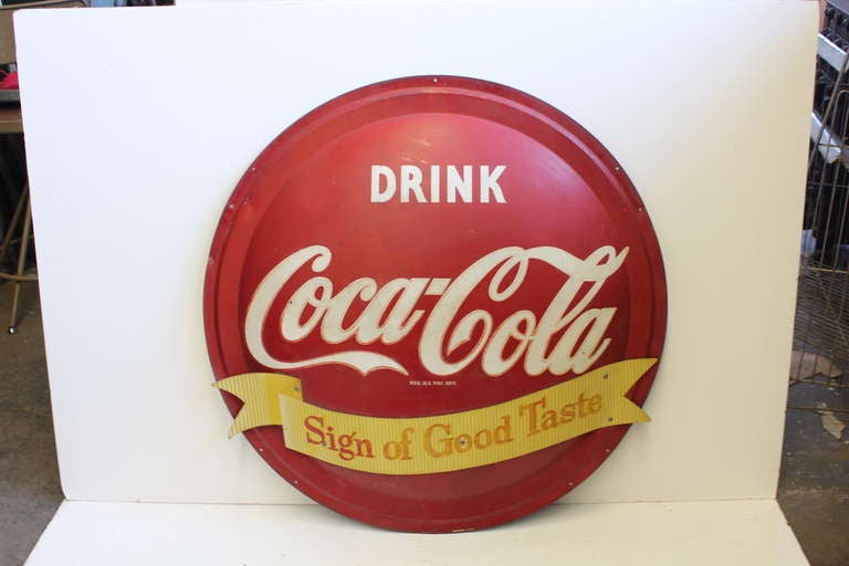 1950's metal Coca Cola button advertising sign.