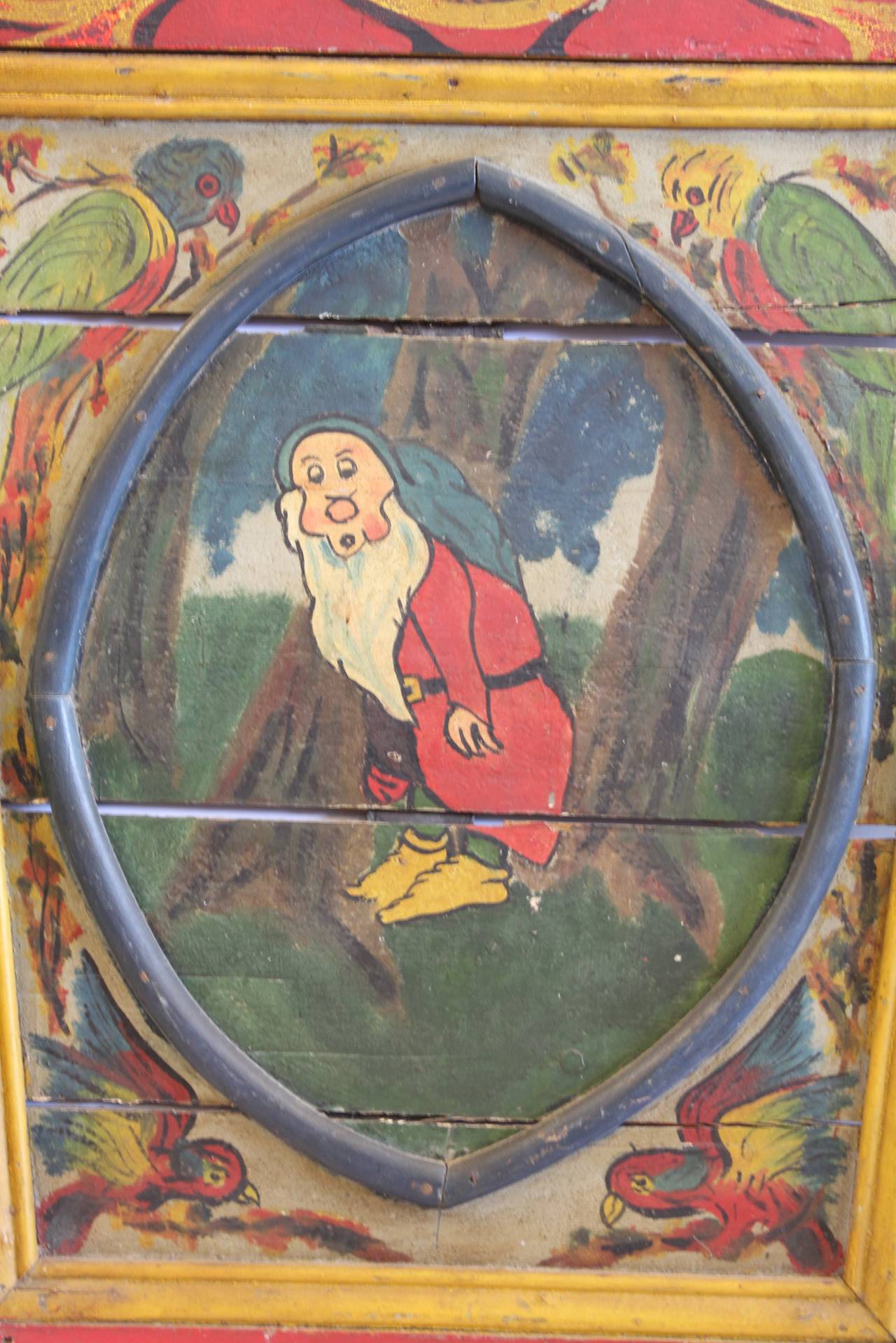 1940s carnival ride door with a snow white scene.
Hanging hardware attached on the back