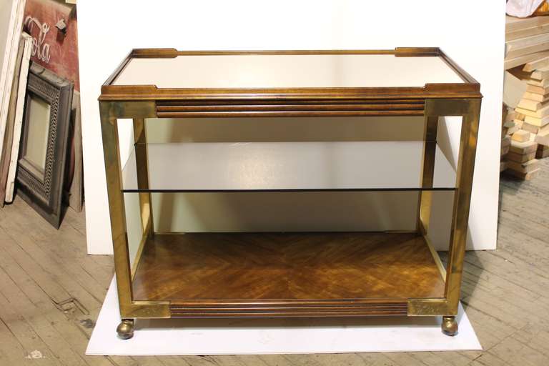 Large elegant brass & wood bar cart by Drexel with glass and mirror shelves.