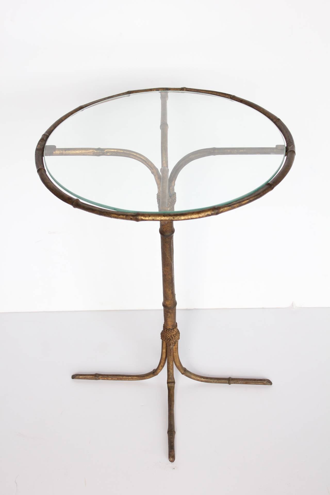 Stylish Italian gold leaf base martini table with glass top.