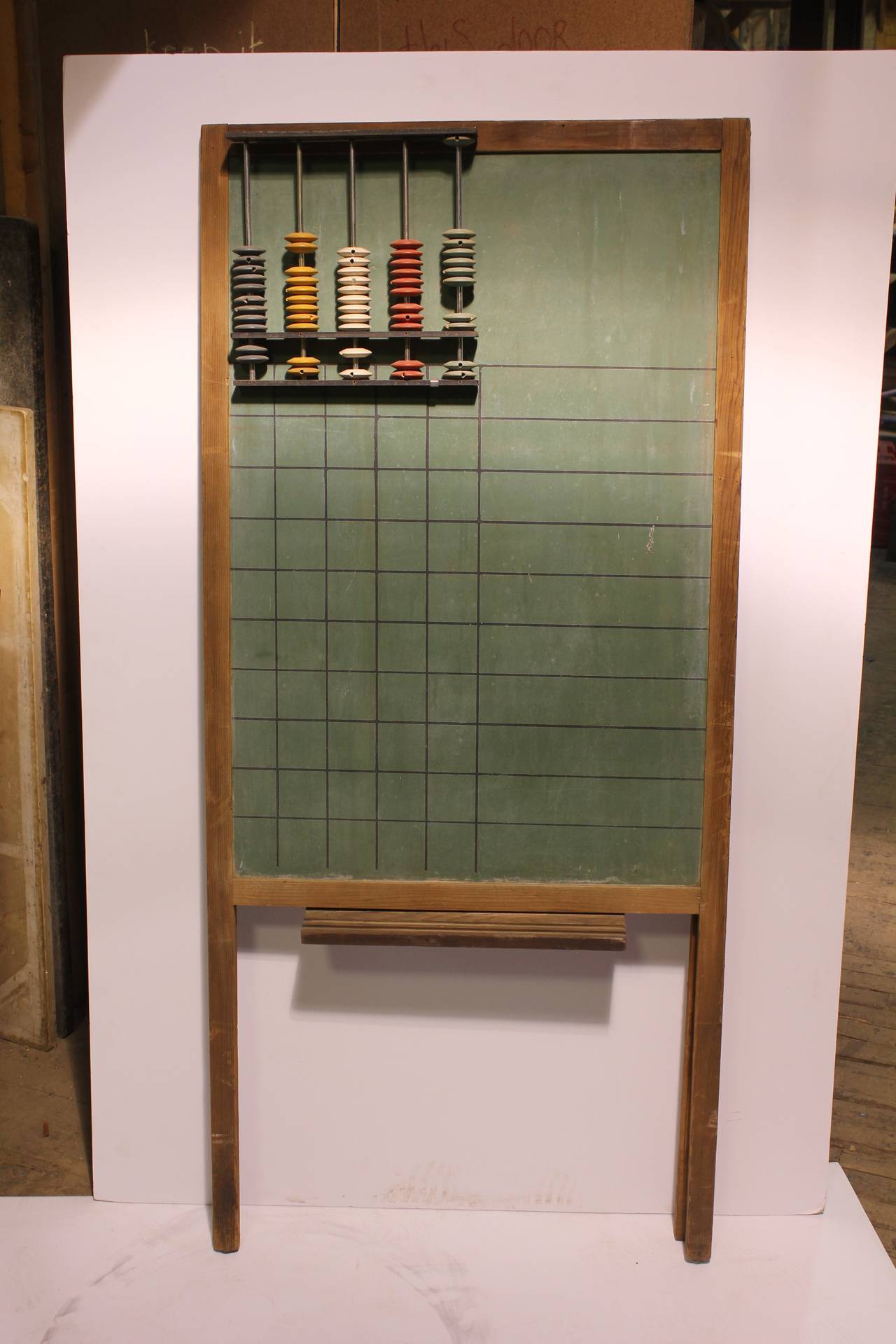 Vintage school chalkboard with attached abacus. This chalkboard could be hang on the wall.