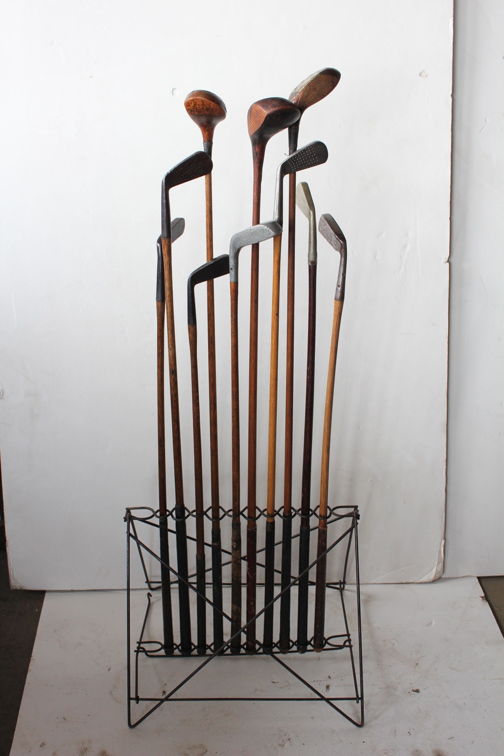 Antique Iron Stand with Antique Golf Clubs