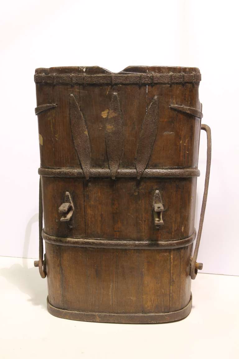 Unusual antique wood and wrought iron water bucket with handle.