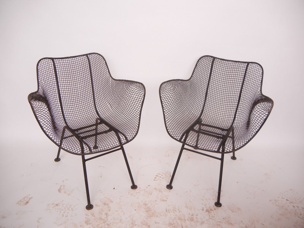 Wrought iron and mesh chairs by Russell Woodard. We do have more chairs available.