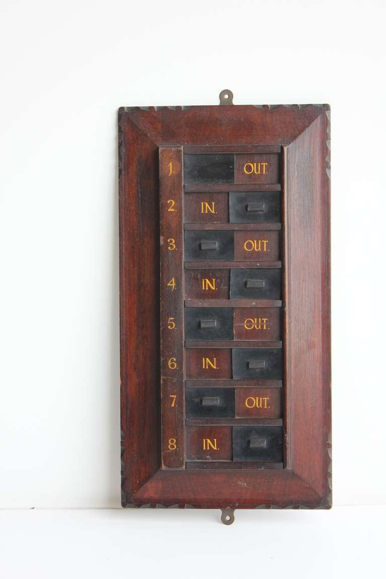 Antique Time In-Out wall plaque.