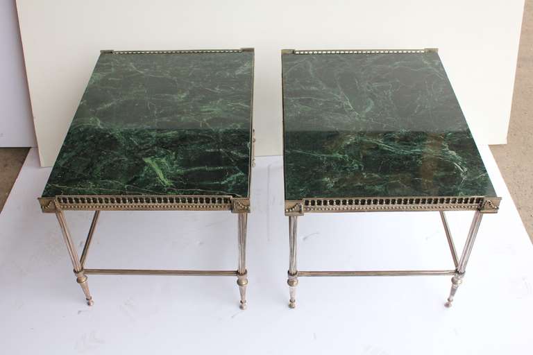 Elegant pair of Jansen style end tables with marble tops.