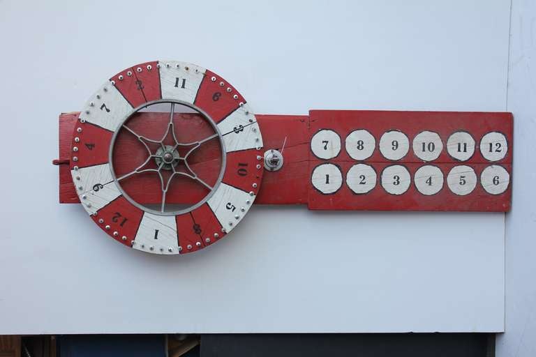Antique wooden game wheel. It spins.