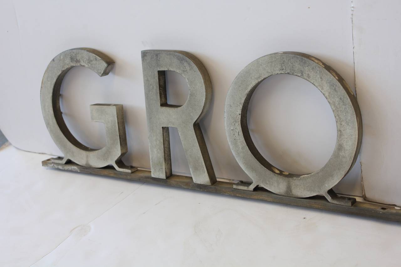 Art Deco metal “GROCERIES” sign.