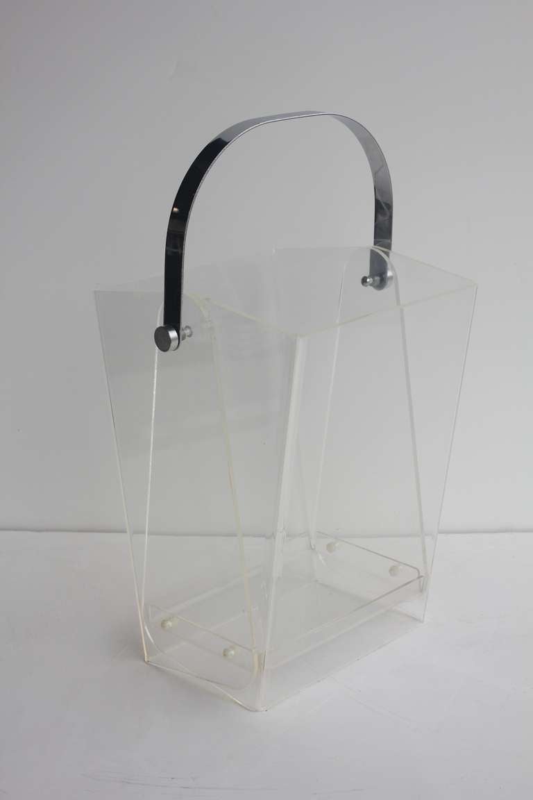 Over sized Modern lucite magazine holder/waste basket with chrome handle.