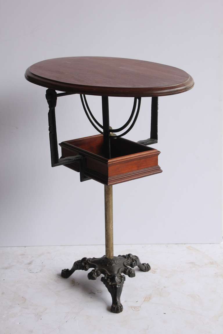 Rare antique tilt top table with adjustable height.
