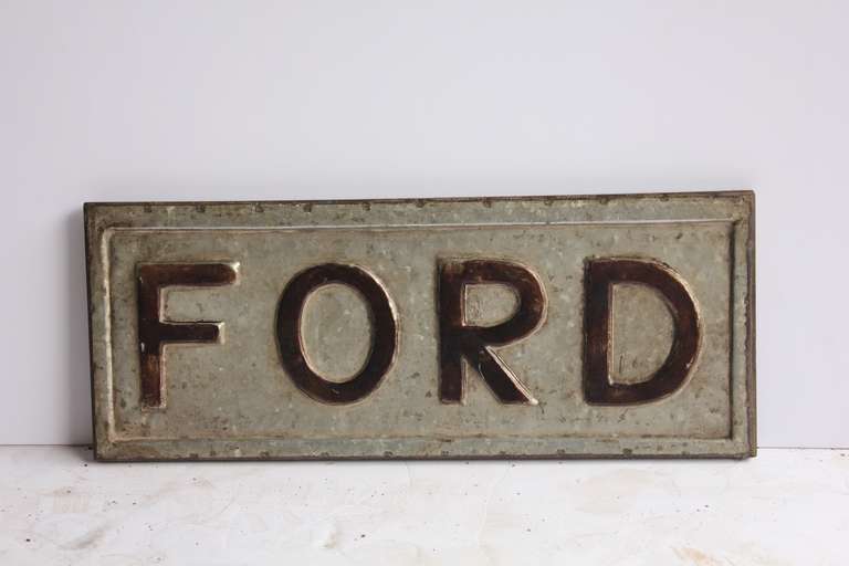 1920s embossed metal sign 