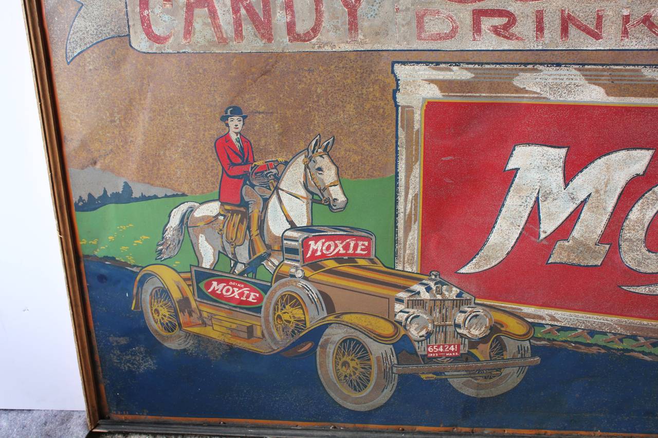 Large rare 1933's tin advertising sign for MOXIE. Framed in original wood frame. Sign in original condition.