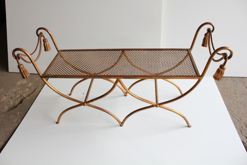 Mid Century Italian gold leaf wrought iron bench with rope design.