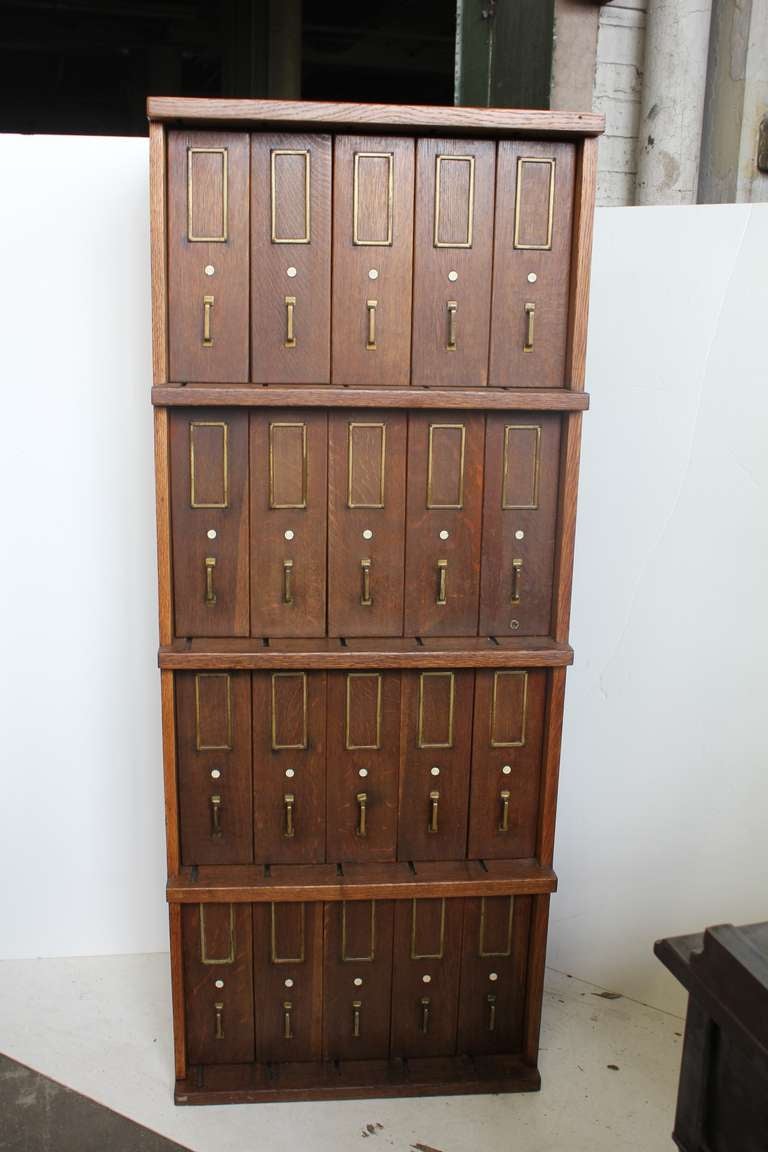Antique oak wood filing cabinet with original brass hardware. We have two matching file cabinets available. Listed price is for one cabinet. ONLY ONE CABINET AVAILABLE