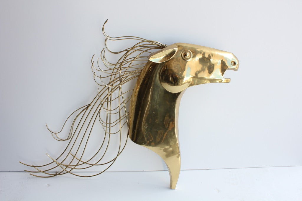 Mid Century brass horse wall plaque by Curtis Jere. It is signed.
