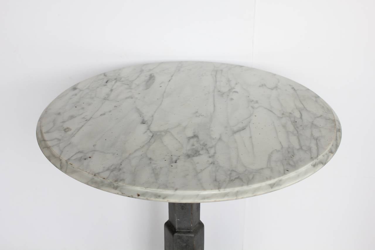 Antique American metal base Industrial table with round marble top.