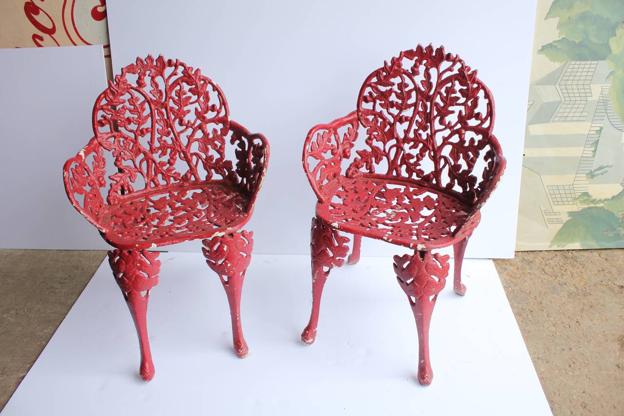 Stylish antique cast iron garden chairs. Original paint.