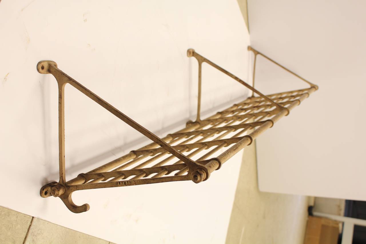 Antique rail road car luggage and coat rack. We have four available.