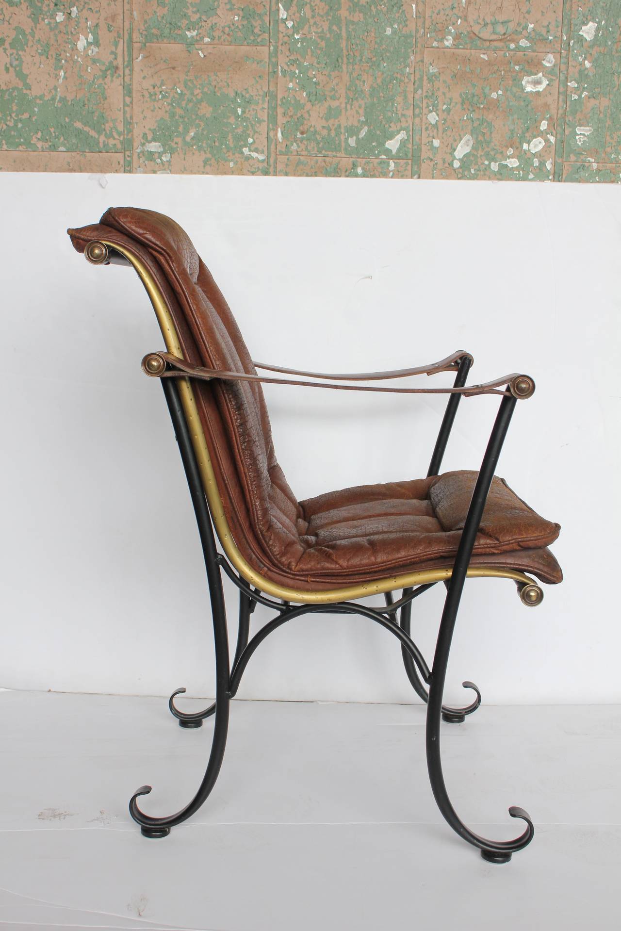 Rare 1940s leather and iron armchair by Lee Woodard. Original leather upholstery.