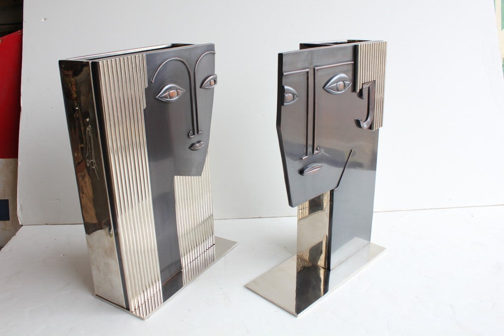 Amazing set of two large Art Deco style Woman's and Man's Face art vases. They are influenced by the work of Hagenauer. They are not signed.
