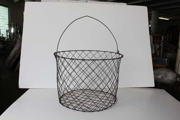 Over sized antique hand made wire basket.
