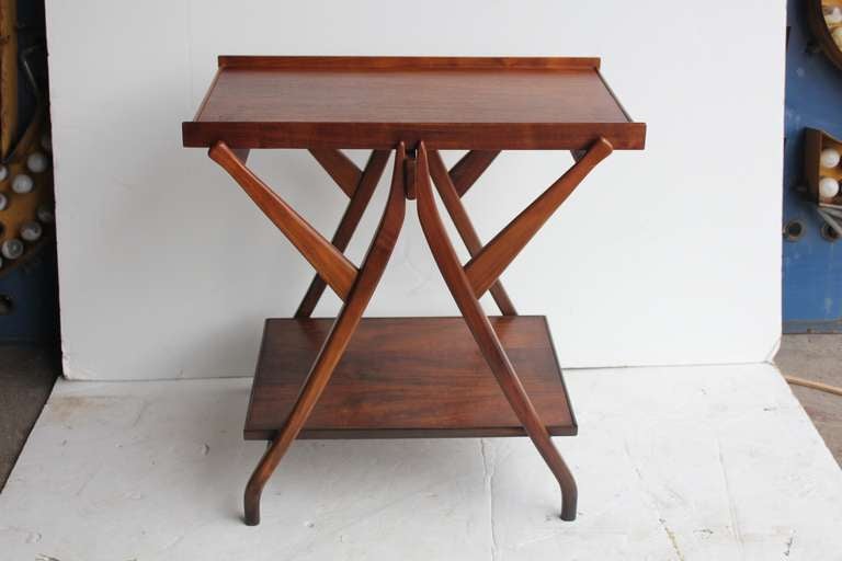 Amazing 1950's walnut serving table/cart designed by Kipp Stewart for Drexel. This table is from Drexel Declaration line.It has removable top tray.