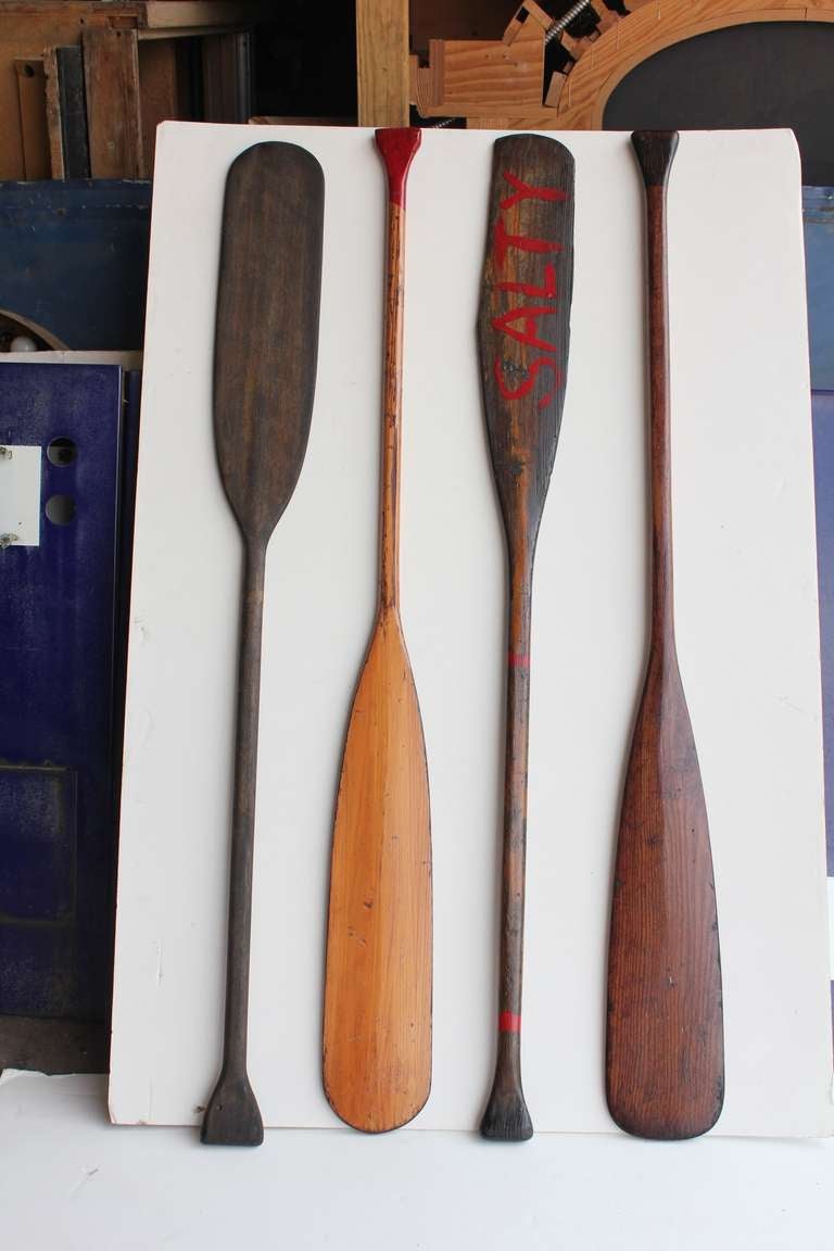 Collection of vintage wooden oars.