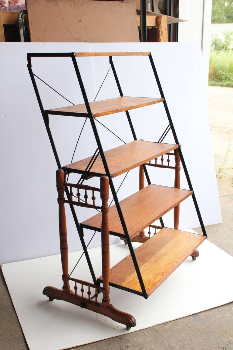 Antique baker's adjustable shelves/table with 5 different settings. Size of the table: H 32.25