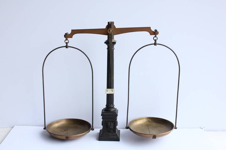 Antique cast iron and brass grocery store scale.