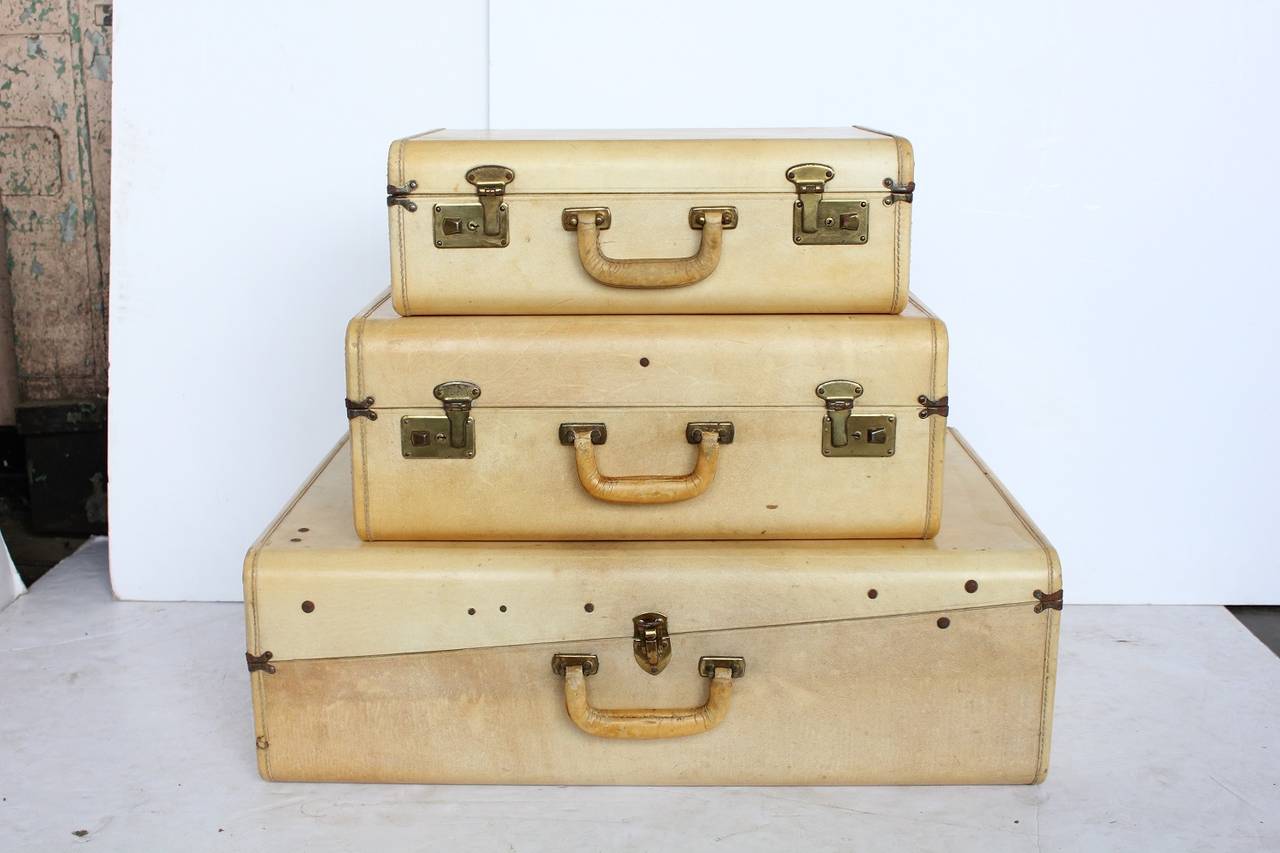 Collection of three vintage Vellum suitcases. Dimensions: H 9.5