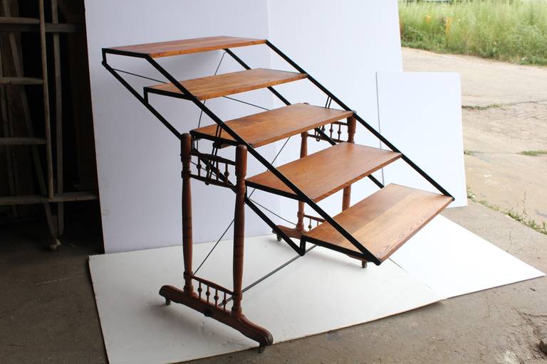 Antique oak and iron baker's adjustable shelves/table. Size of the table: H 32.25