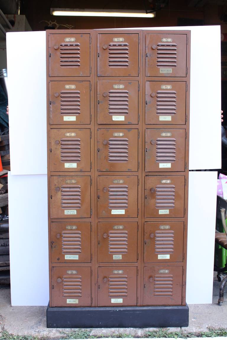 1930s industrial metal lockers on wooden base. Original paint.