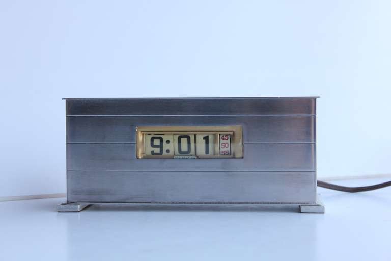 Great original 1950's streamlined style digital clock in brushed aluminum case with bakelite numbers by Pennwood Numechron Co. In working condition.
