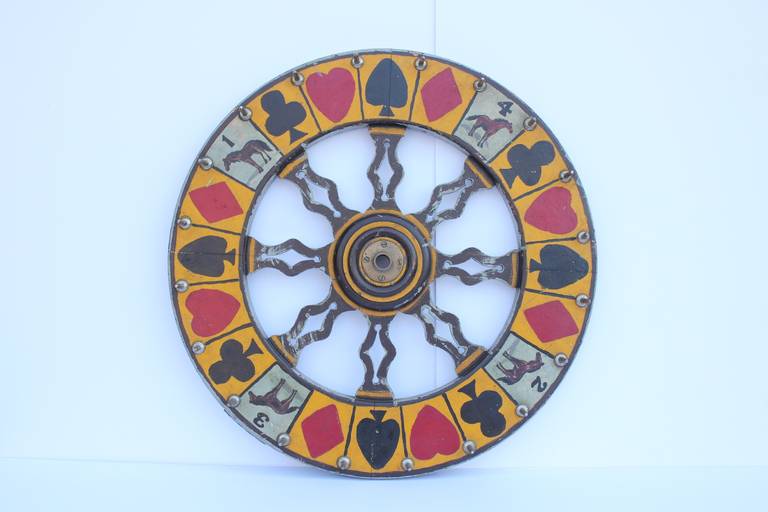 Vintage hand-painted carnival game wheel.